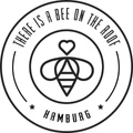 There is a bee on the roof logo