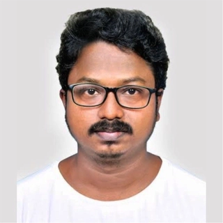 Dinesh M.