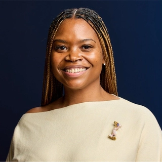 Indira Fuller-Bey Cmp, Des